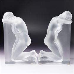 Pair of Lalique 'Reverie' glass bookends formed as two kneeling nude figures in clear and frosted glass inscribed 'Lalique France' to the plinth base H23cm