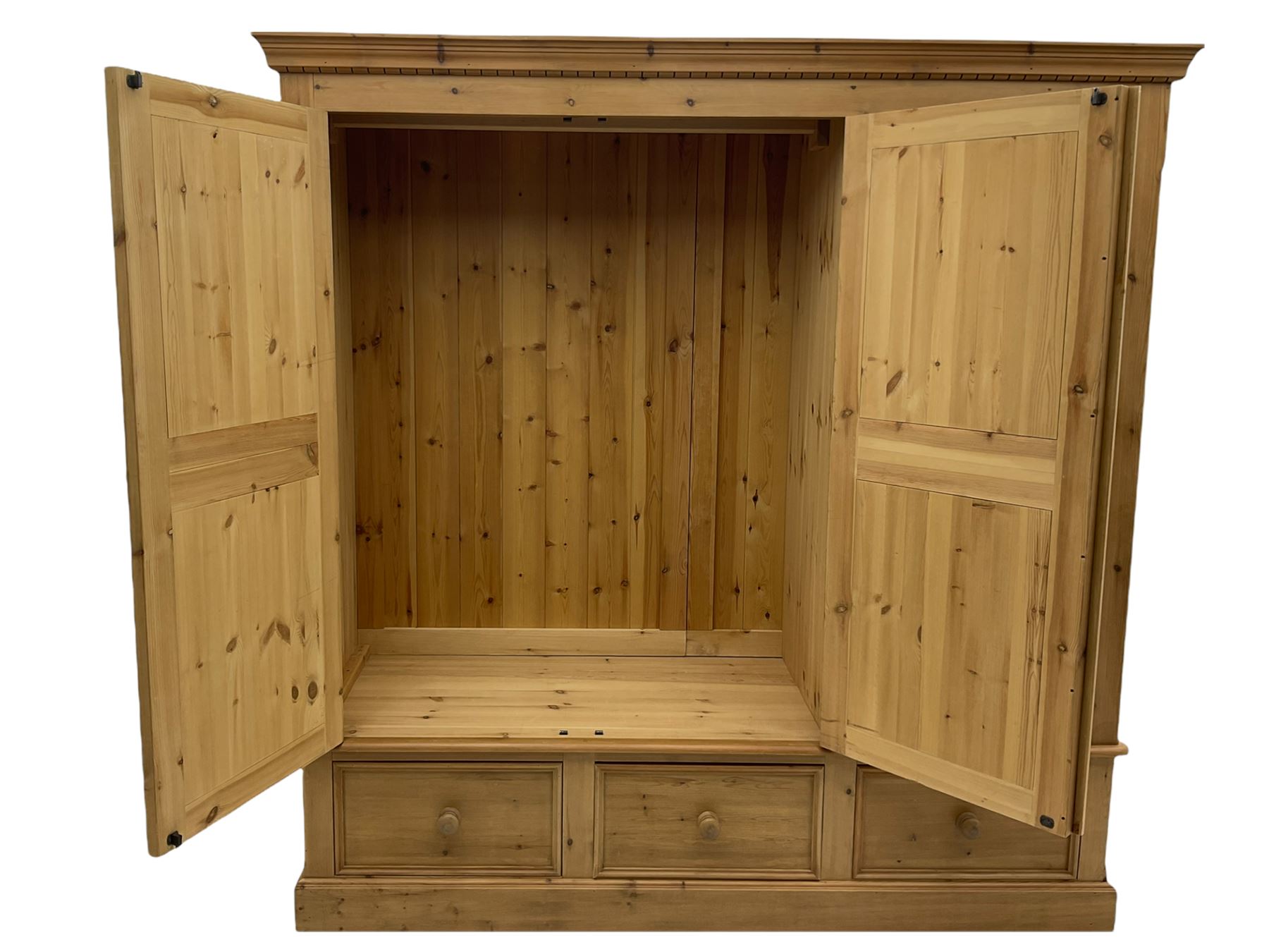 Solid pine triple wardrobe with three drawers