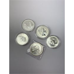Five silver bullion coins, each containing one troy ounce of fine silver