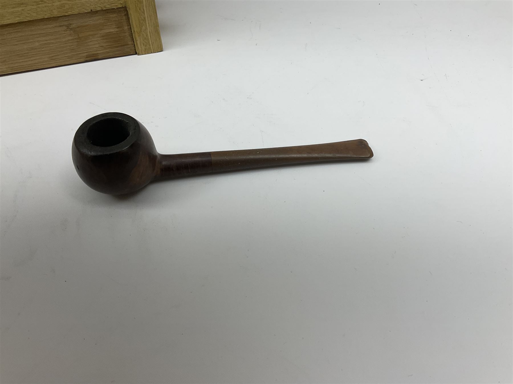 Pipes and two tiered wooden rack together with eleven pipers, including briar pipe carved as a wolf, Sea Dog straight pipe, John Brumfit pipe, meerschaum pipe ect, pipe rack H29.5cm