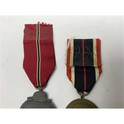 German War Merit Cross 1st Class, the pin-back stamped '50'; War Merit Medal; and Ostfront Medal for the Winter Campaign in Russia of 1941-1942 'Die Medaille Winterschlacht Im Osten'; all with ribbons (3)