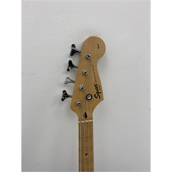  Fender Squier Bronco Affinity Series electric bass guitar, in black and white, serial no. IC021107489, L108cm, in associated Squier soft carrying case. From the collection of the late John Burgess of Beverley who played in the bands Penjants, Wine, Strollers, Revox, Sound Foundation, Pickle Belly Alley, Ragamuffins and Jerryattricks.