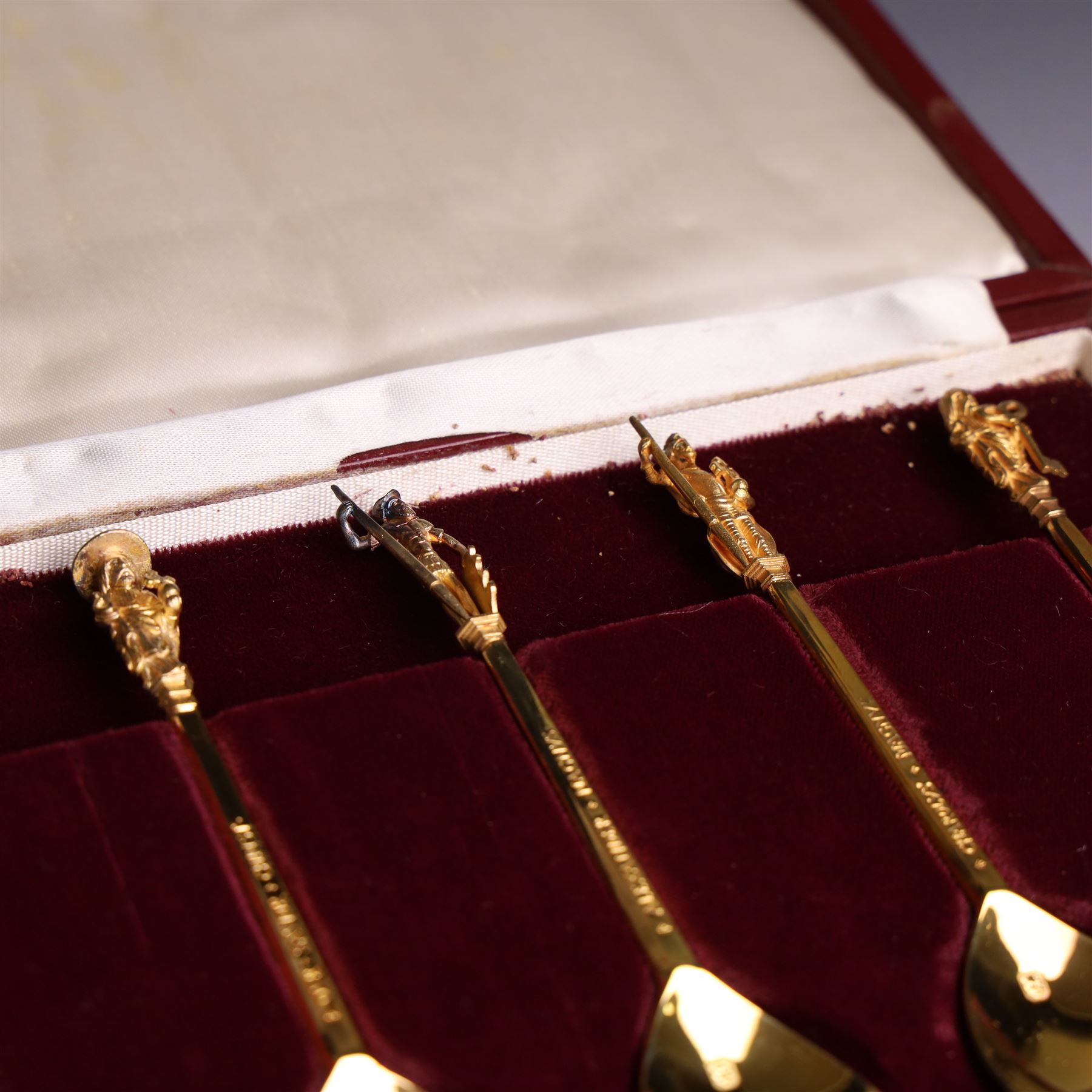 Set of twelve 'The Tichborne Collection' silver gilt spoons, each with fig shaped bowls, the finials depicting different historical figures including Queen Elizabeth, Hector of Troy and Saint Peter, hallmarked Birmingham Mint 1978, in fitted case