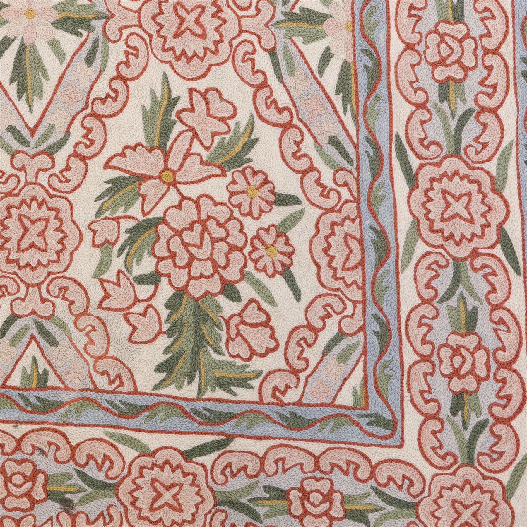 Kashmiri chain stitch crewel embroidered wall hanging, wool on cotton ground, decorated with an all-over lattice of floral medallions and stylized foliage with multiple floral borders 