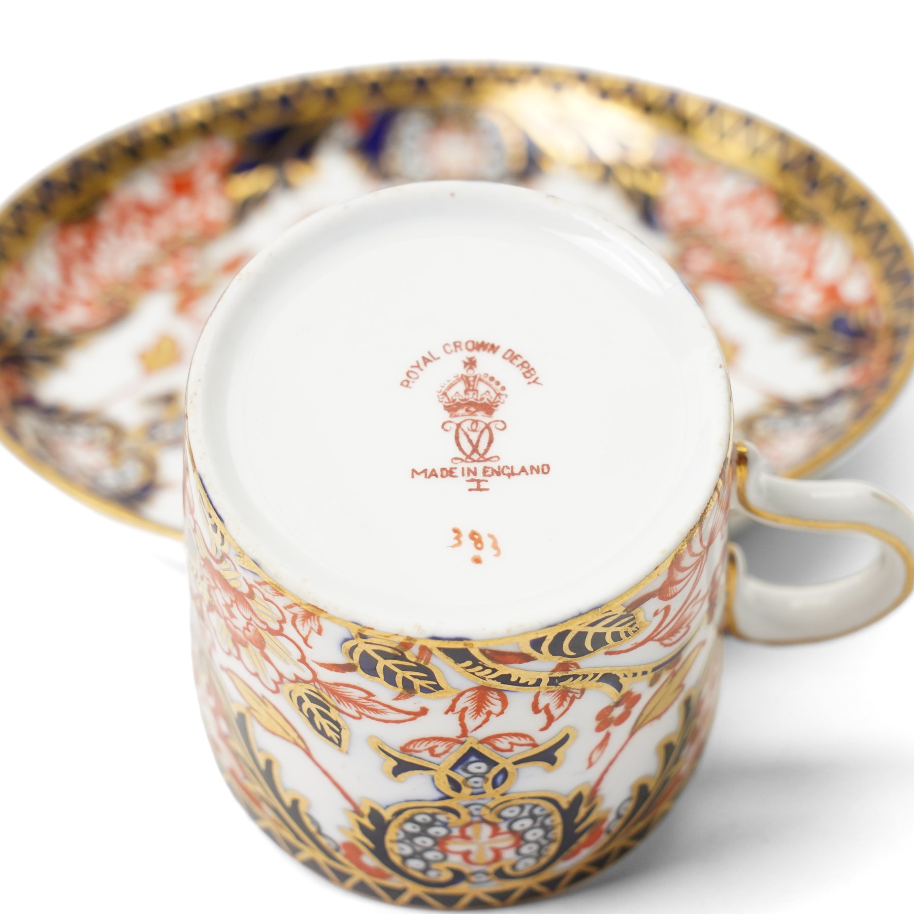 Six Royal Crown Derby coffee cans and saucers, pattern 383, together with six Aynsley coffee cans and saucers