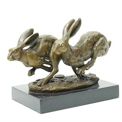 Bronze figure group, modelled as two hares in chase, after 'Nick', with foundry mark, upon...