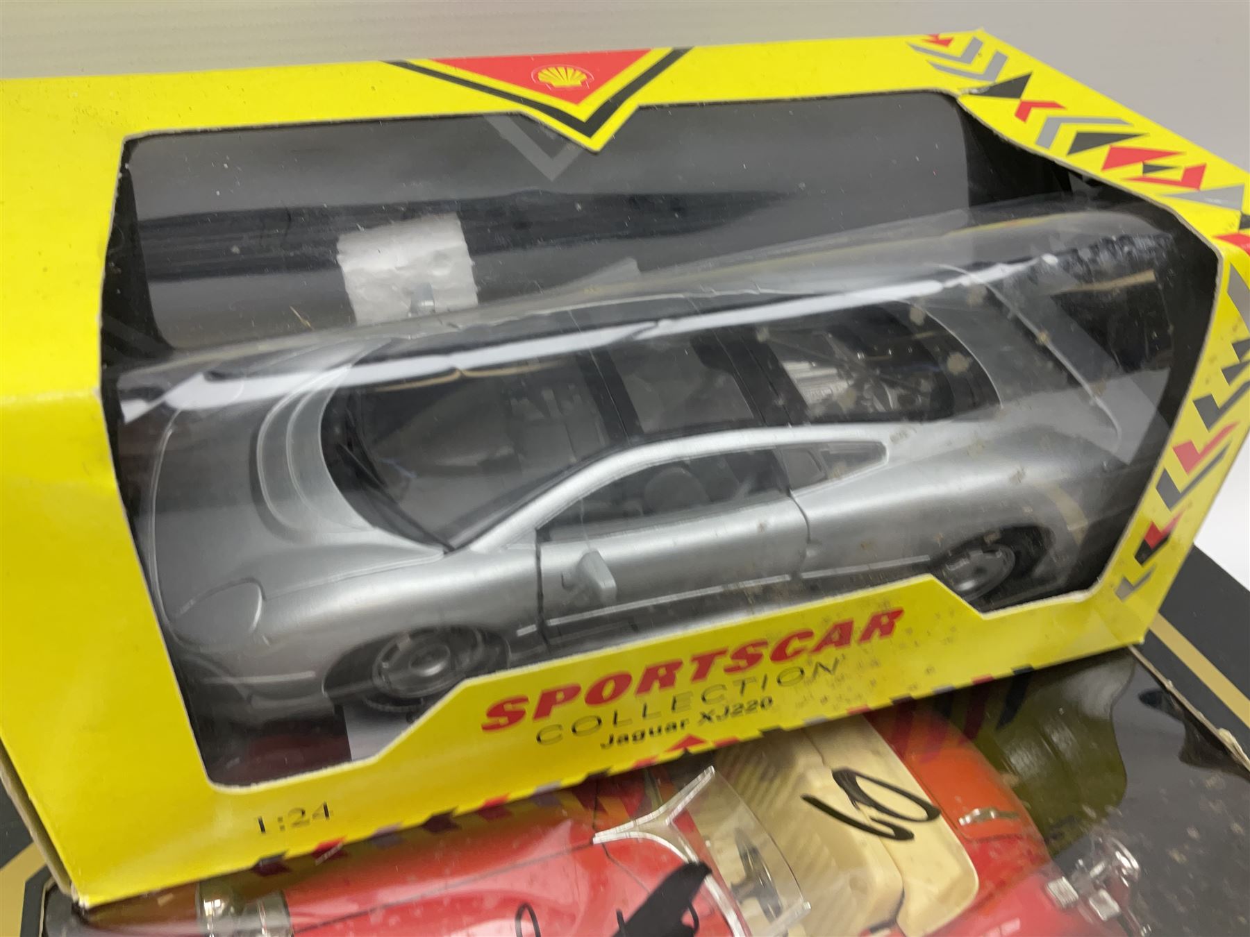 Seventeen Shell Sportscar Collection die-cast models including 1:24 scale Jaguar XJ220 by Maisto; and Bburago 1:20 scale die-cast model Mercedes Benz 500K Roadster (1936); all boxed (18)