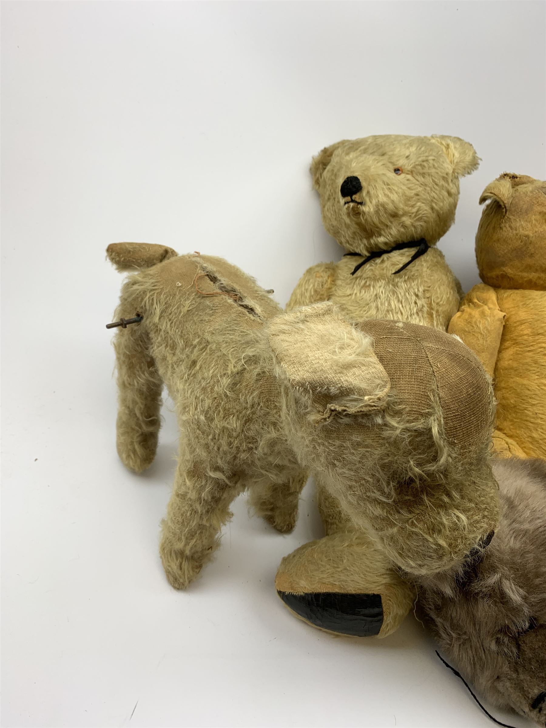Quantity of early wood wool filled teddy bears for restoration.