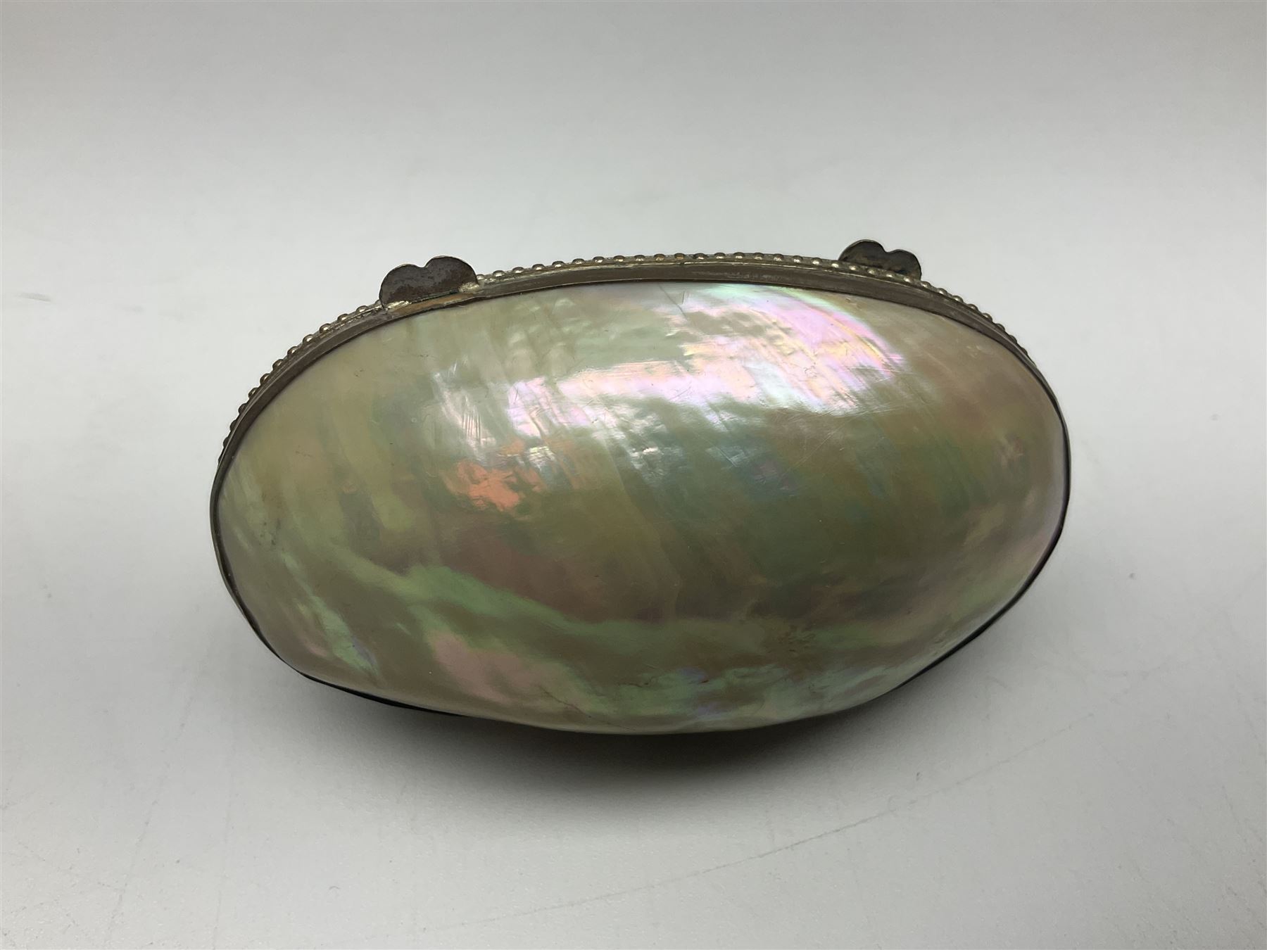 19th century lacquer thimble case with painted portrait of a woman to the hinged lid, together with two mother of pearl egg shaped thimble cases and one other