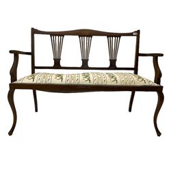 Edwardian walnut settee, shaped cresting rail with fan inlay over three pierced splats, with upholstered seat in raised floral needle work, on cabriole supports