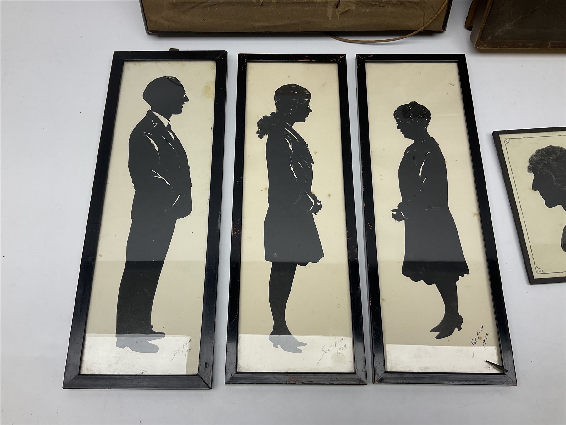 Three early 20th century full profile framed silhouettes, each signed Scot-Ford 1929, together with four hand painted portrait silhouettes and two framed crystoleums, depicting figural scenes (9), largest H35cm