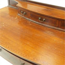 Edwardian mahogany dressing table, rectangular top above a central kneehole drawer flanked by two short drawers over two graduated drawers to each pedestal, raised superstructure with three small drawers and oval swing mirror on shaped supports, on square tapering legs with castors