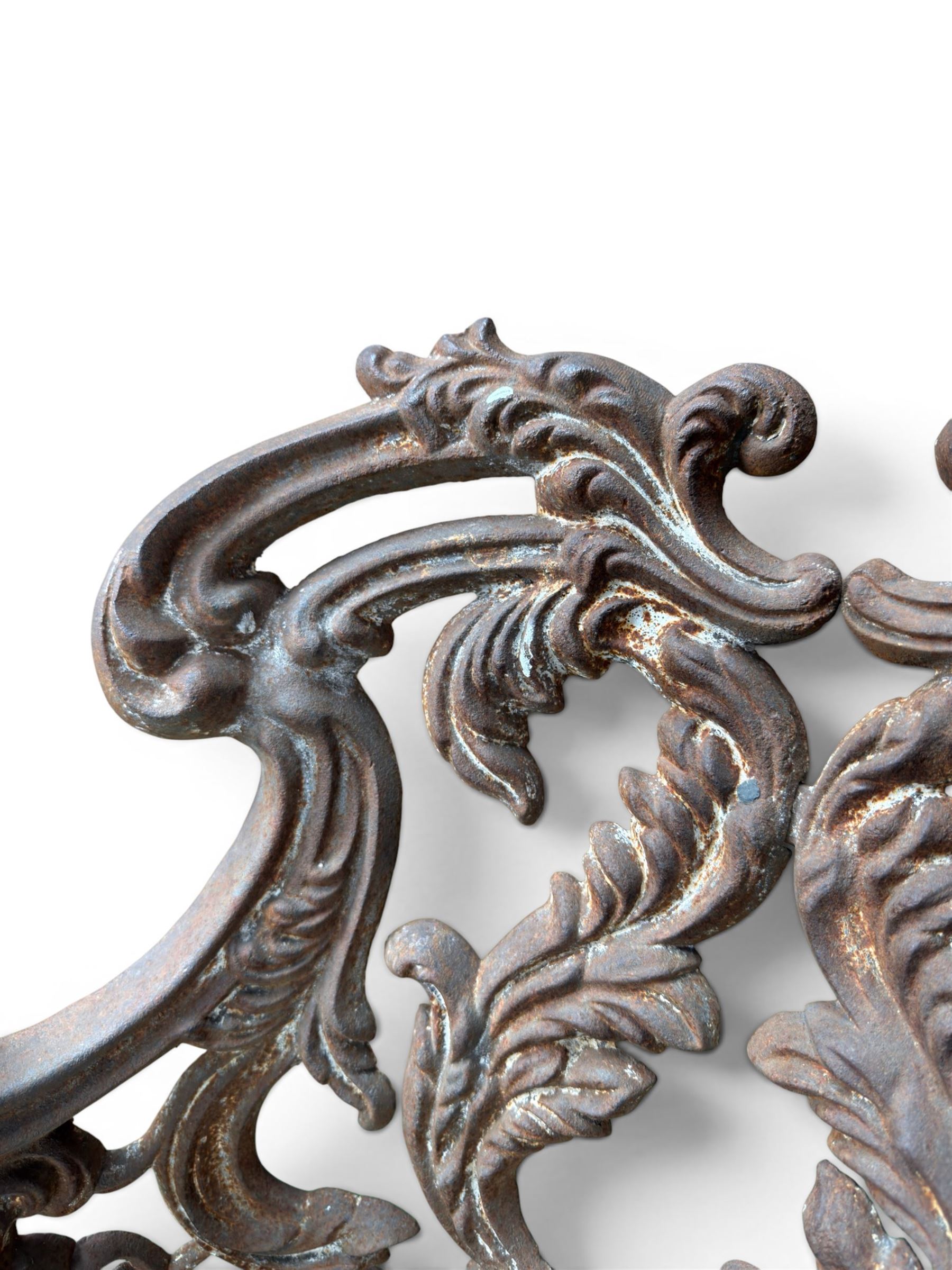 19th century Rococo Revival cast iron garden chair, pierced back comprised of scrolling acanthus leaves, over a pierced geometric white painted drop-in seat, raised on four acanthus and anthemion shaped cabriole supports united by X-frame stretcher