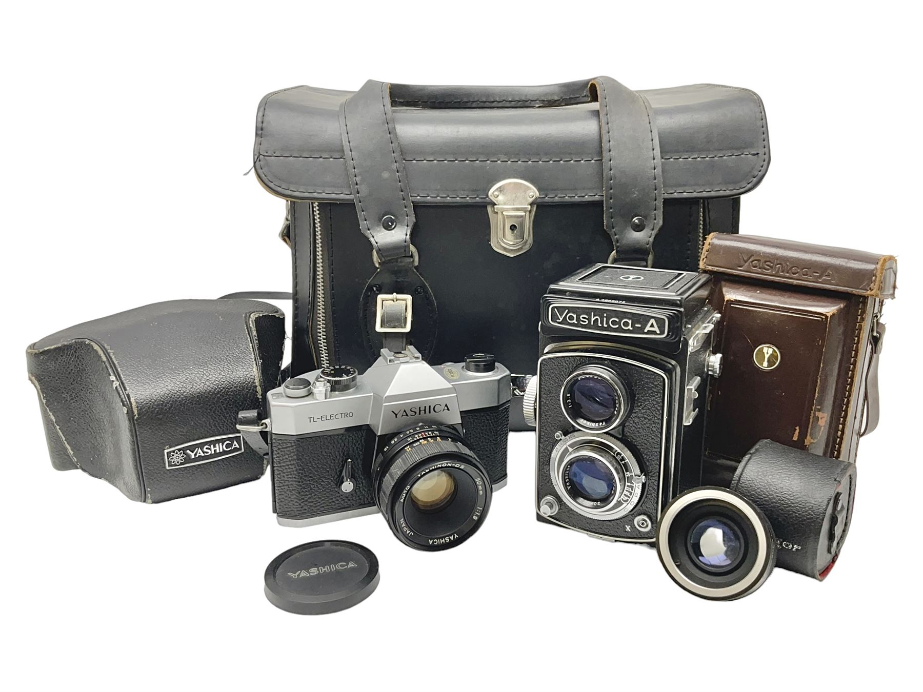 Yashica-A camera body, serial no. A4080073, with 'Yashikor 1:3.5 f=80mm' lens, serial no. 209272 and 'Yashikor 1:3.5f=80mm' lens, serial no 22942, together with Yashica TL-Electro camera body, serial no. 5054162 with 'Yashinon-DS 50mm 1:1.9  40056038