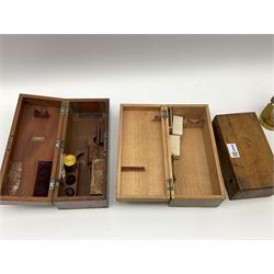 Carl Zeiss Jena brass monocular microscope, lacking all lenses, serial no.5822, in fitted mahogany box H26.5cm; another unmarked brass and black enamelled monocular microscope in fitted case with quantity of slides; and a pine microscope slide box of oblong fall front form with twelve removable trays (unstocked) (3)