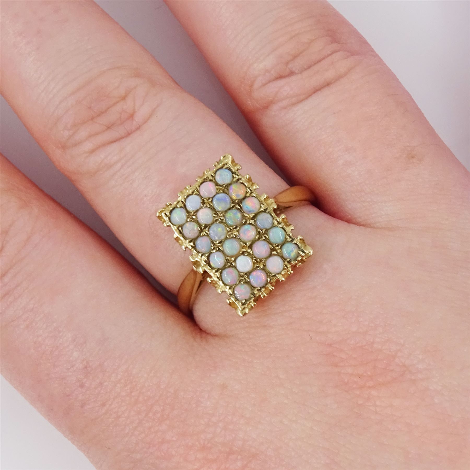 9ct gold opal panel ring, set with twenty-four opals, hallmarked