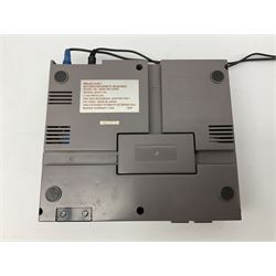 Nintendo Entertainment System (1985) console with two controllers, accessories and instruction booklet. NES Games ‘Duck Hunt’ with Nintendo Zapper gun, ‘Pinball’ and ‘Super Mario Bros.’, all with original sleeves and instruction booklets. NES game ‘Super Mario Bros. 2’ cartridge only