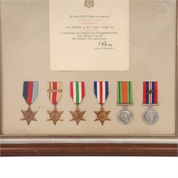 WWII British medal group, composing 1939-1945 Star, African Star, Italian Star, French and German Star, Defence medal and War medal with oak leaf clasp, awarded to Corporal S Dobson Royal Engineers, framed, with Royal Engineers shoulder badge and a mentioned in dispatches certificate, H58cm,W49cm 