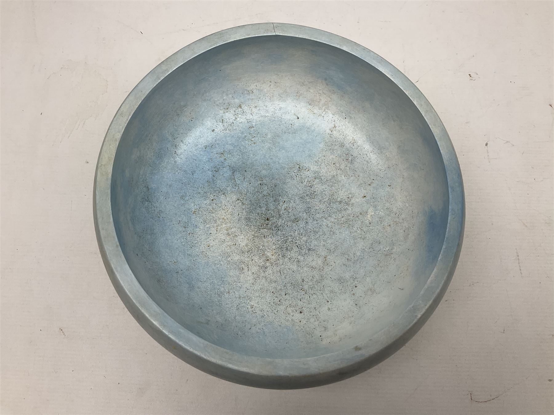 Wooden hand painted bowl, decorated with trees on a blue ground, signed Phil Crennell beneath, D28cm