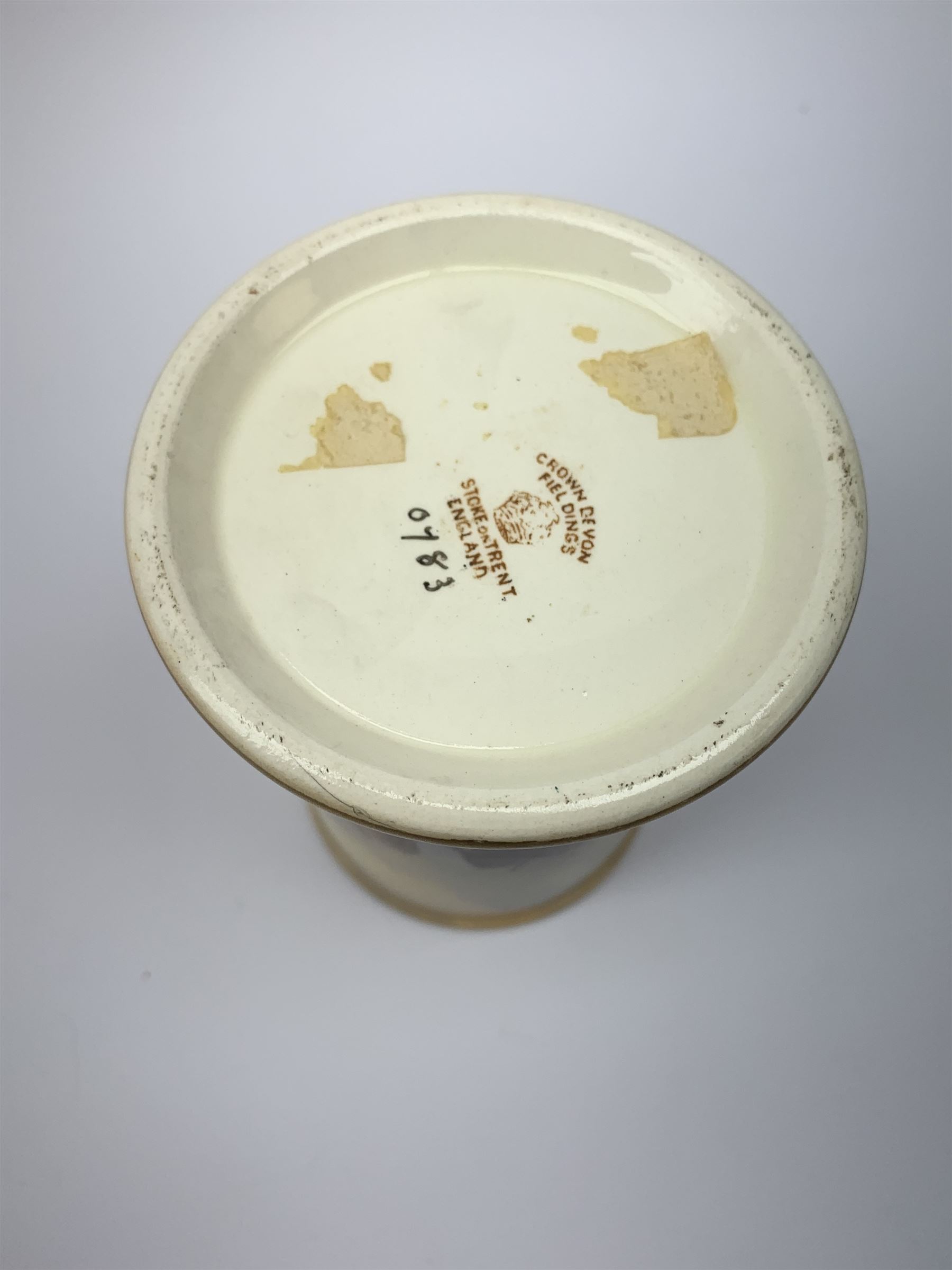 A Crown Devon Fieldings vase, of cylindrical form painted with a highland cattle scene and signed Cox, with printed marks beneath, H11.5cm