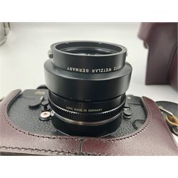 Leitz Leicaflex SL2 camera body, serial no.1387046, with 'Summicron-R 1:2/50 Leitz Wetzlar' lens, serial no. 2273397, within a leather Leitz lens hood 