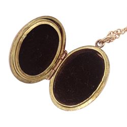 Rose gold oval locket with engraved decoration, on gold cable link necklace, both hallmarked 9ct