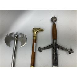 Two replica weapons, consisting of a double headed battle axe and a sword, together with a brass birdhead topped walking stick, stick H67cm