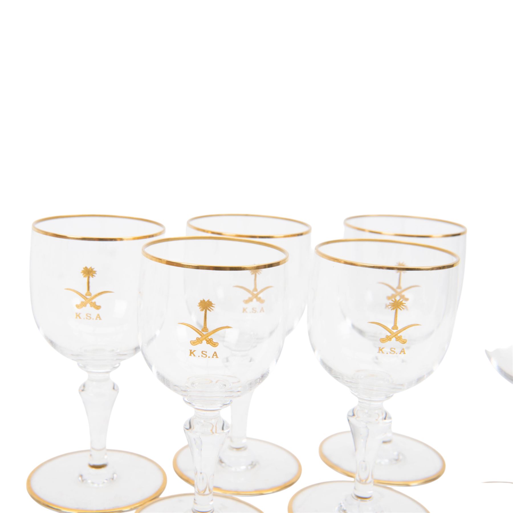 Baccarat decanter, six wine glass and six port glasses,  all with a gilt band to the rim and foot and motif for Kingdom of Saudi Arabia