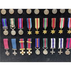 Two limited edition large framed display boards with half-size copies of British Gallantry and Campaign Medals produced by Danbury Mint and entitled 'For Valour'. Sixty medals on each board, all with ribbons. Complete with Danbury Mint certificate serial number A0148 and other paperwork.