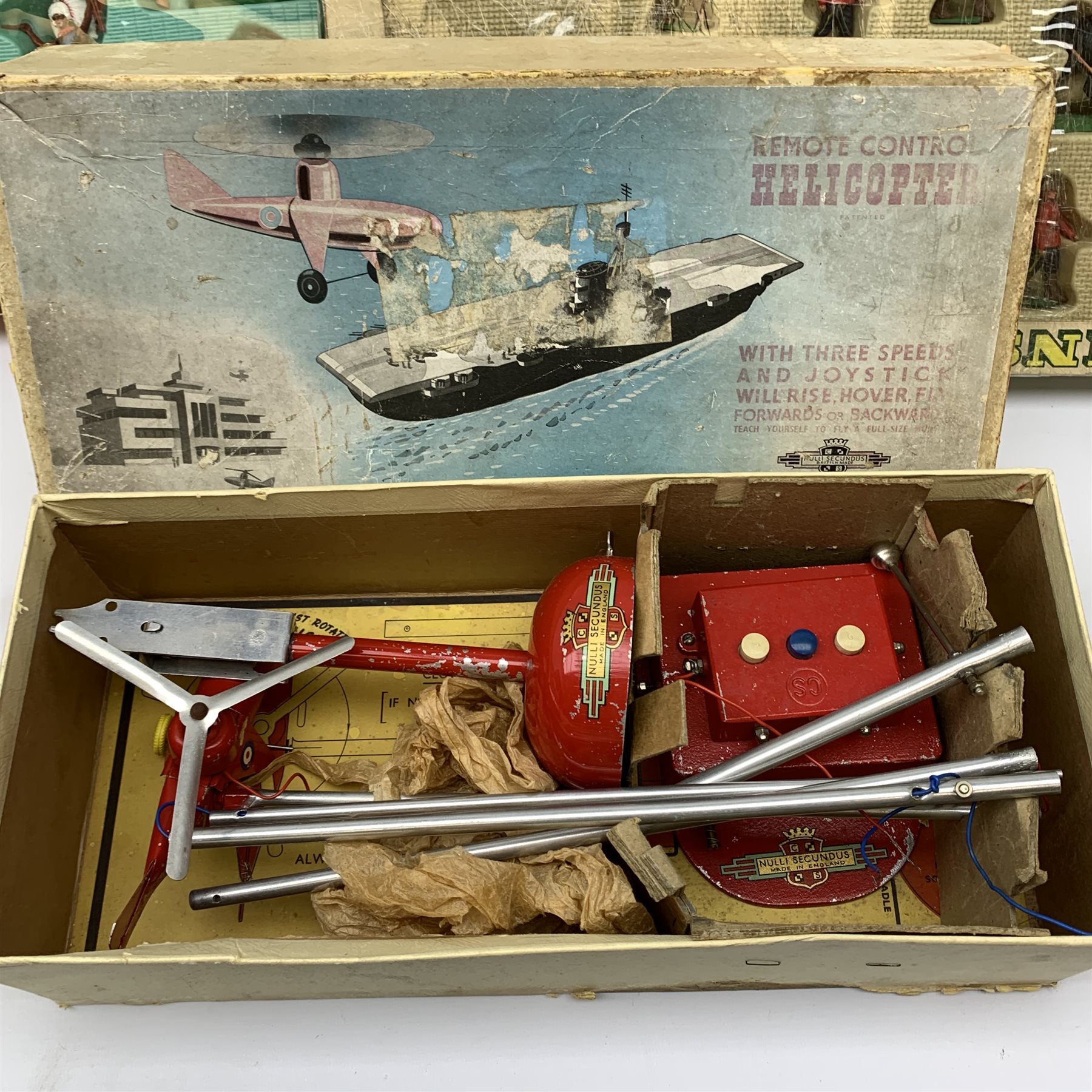 Britains Deetail Cowboys and Indians set No.7630, boxed; Britains part set of Royal Canadian Mounted Police No.7695, boxed; and Nulli Secundus Remote Control Helicopter, boxed (3)