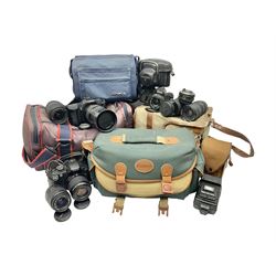 Cameras and accessories, to include Olympus OM101 Power Focus camera body, serial no 1076067, with 'Sigma AF Zoom 1:38, f=75 200mm' lens, serial no 2053714, Canon EOS 5000 camera body, serial no 1507812, with 'Canon Zoom EF 80-200mm, 1:4.5-5.6' lens, other cameras, by Miranda, Coronet and Ricoh and a collection of lenses, carry cases, etc 