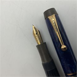 Four Parker Duofold fountain pens, together with Parker Duofold junior, all with 14ct gold nibs  
