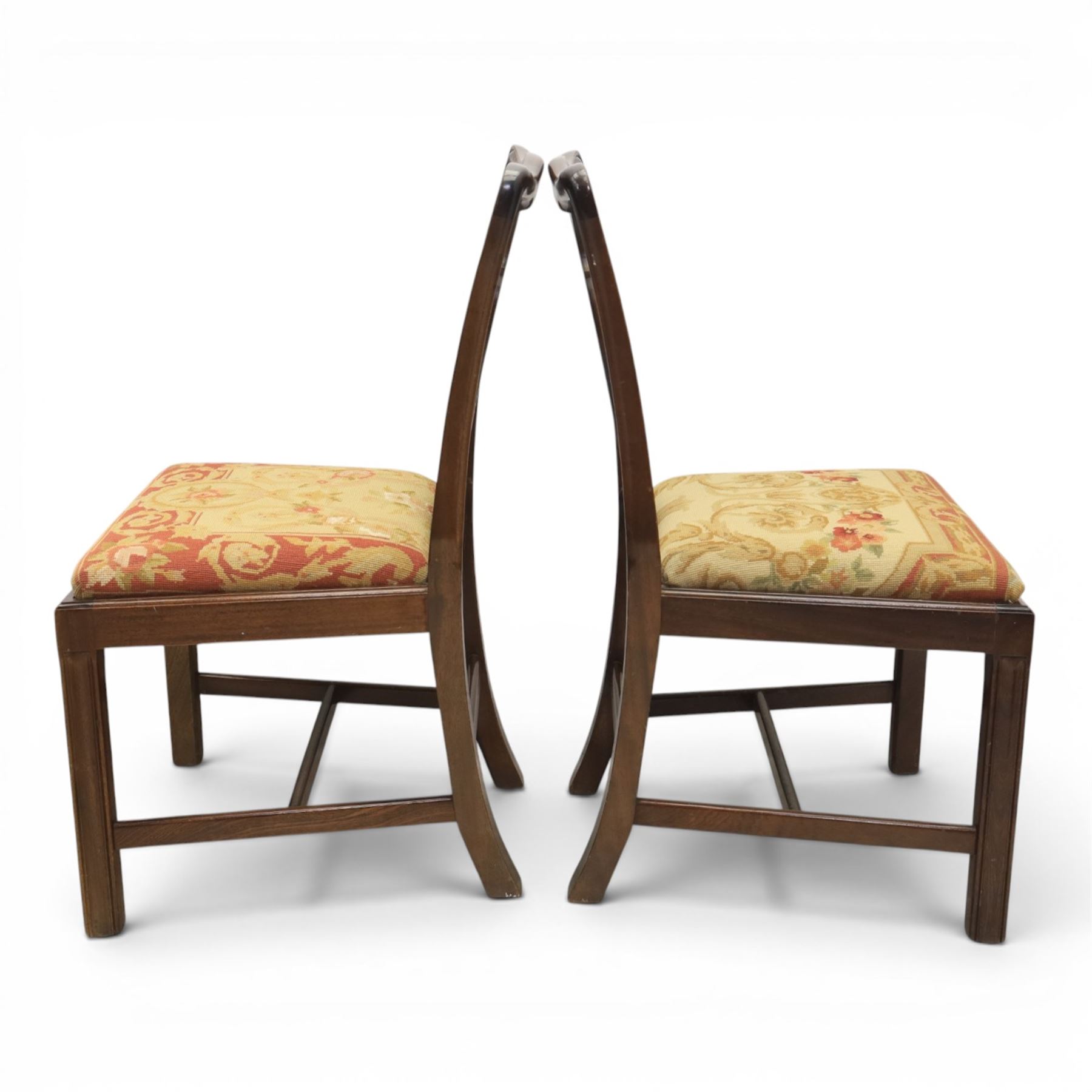 Large 19th century mahogany extending dining table with set of Chippendale design chairs, extending dining table with rectangular moulded top additional three leaves, raised on turned supports terminating in brass castors, the dining chairs (2 + 2) with shaped cresting rail and pierced splats, raised on square supports with stretchers