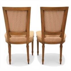 20th century Louis XVI style beech salon suite, comprising settee and four chairs, the settee with shaped rectangular back and upholstered arms over a shaped seat, the chairs with rectangular backs and overstuffed seats, each upholstered in striped fabric with close-nailed borders, upon fluted tapering supports headed by carved paterae, terminating in toupie feet, chairs H89cm W47cm