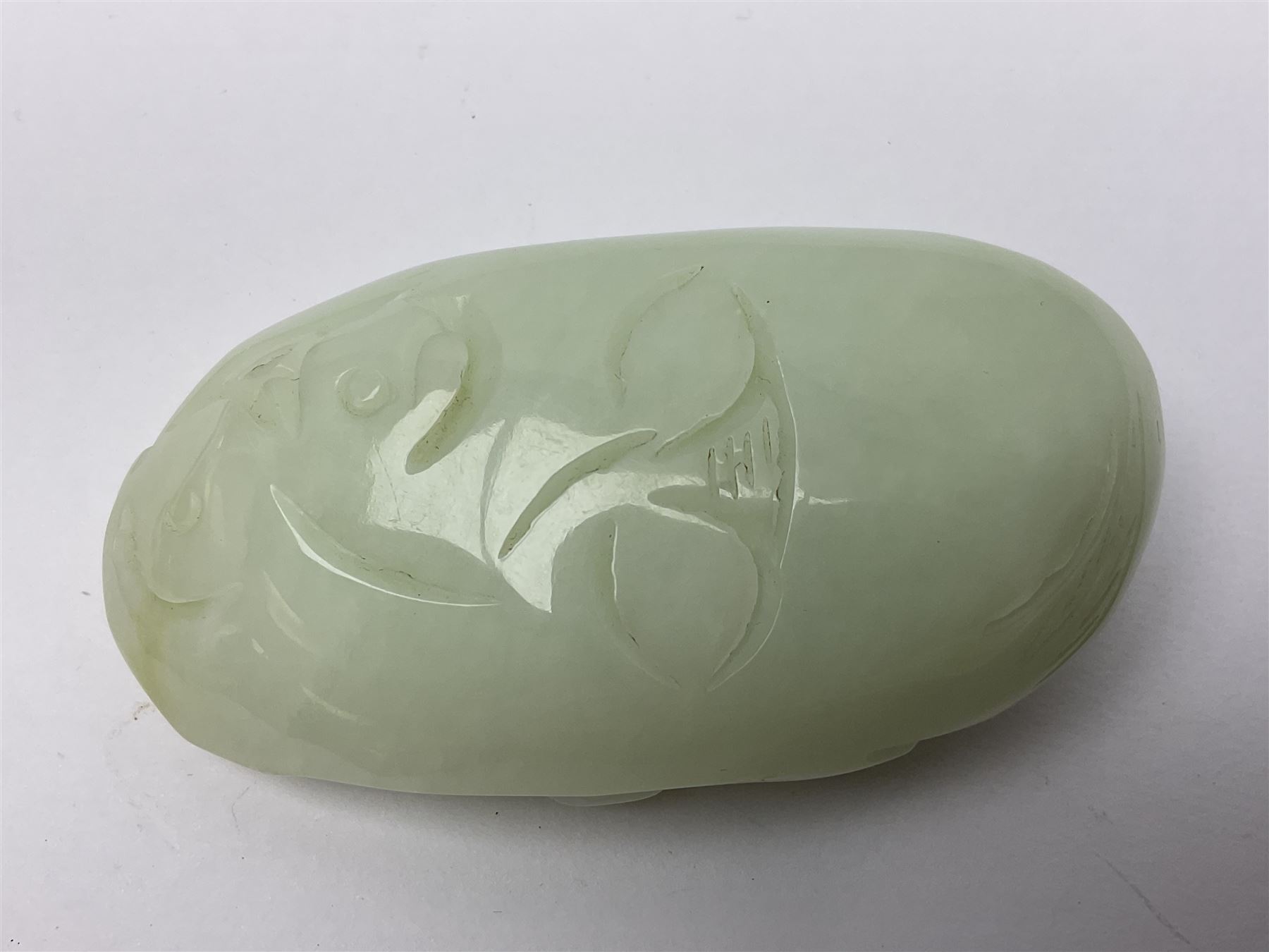 Chinese hardstone carving of a fish amongst coral, with platted rope handle, together with other hardstone and soft stone carvings  