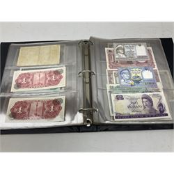 World banknotes, including Queen Elizabeth II The States of Jersey one pound 'DB202703', five pounds 'BB527762' and ten pounds 'AB651481', reserve bank of New Zealand two dollars '1L3 741894', King George V Straits Settlements one dollar 1st January 1935 'F/83 28924', various Bank of England notes etc, housed in two ring binder albums