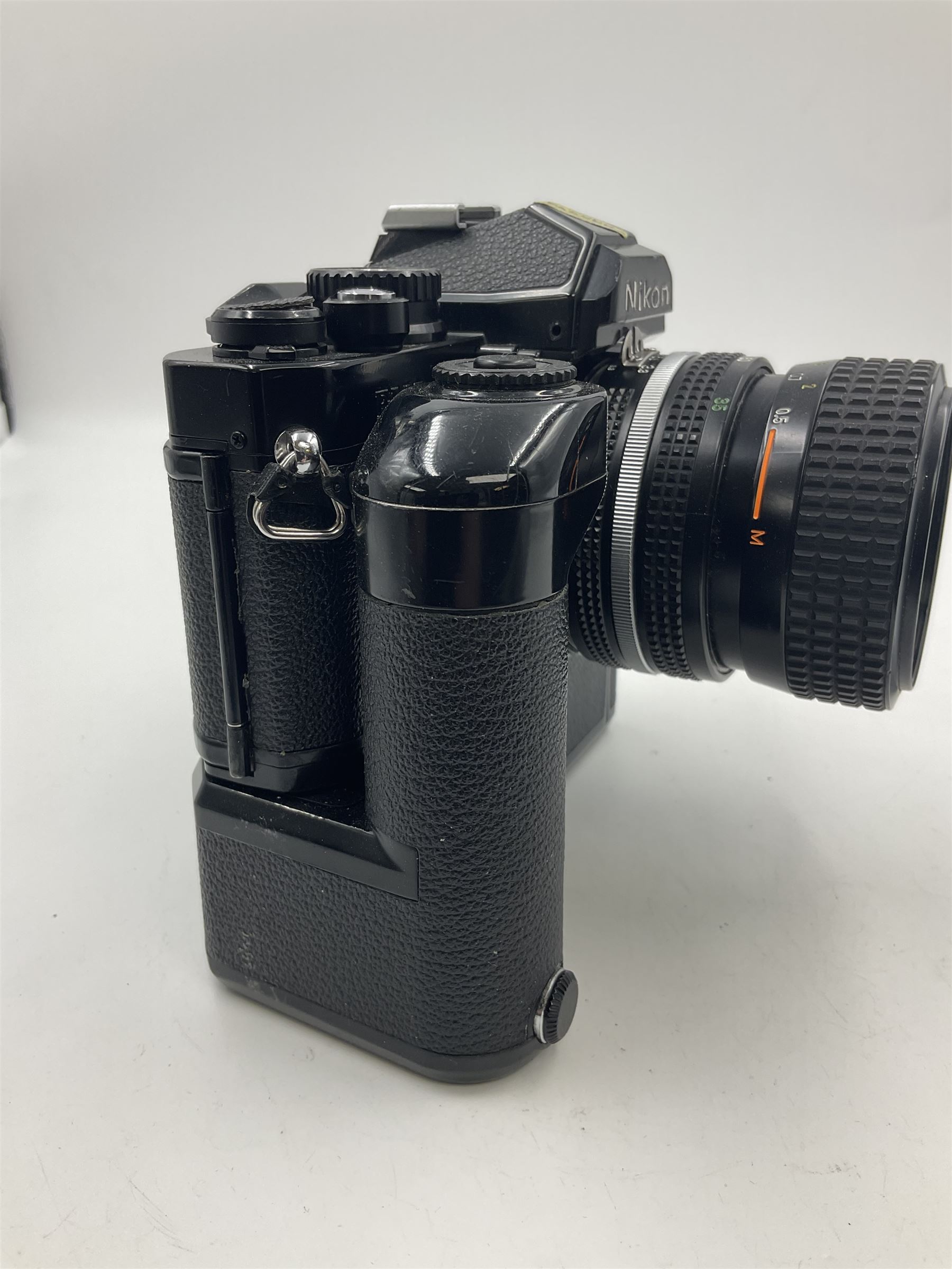 Nikon FM2n camera body, serial no. N8683100, with 'Nikon Zoom-NIKKOR 35-70mm 1:3.3-4.5' len, serial no. 2236565, Nikon MF-16 data back, serial no. 212905 and Nikon MD-12 Motor Drive, serial no 1570382 
