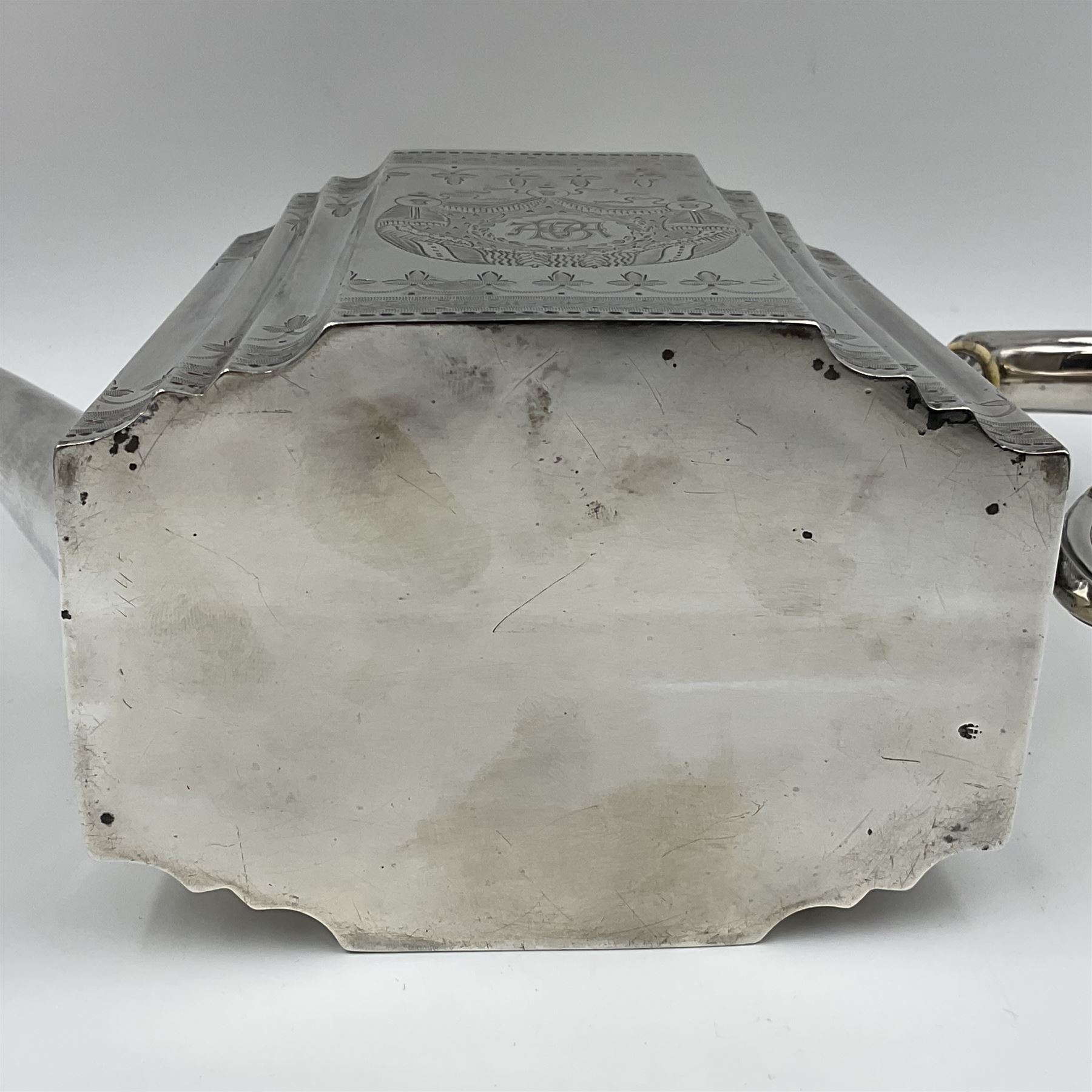 Victorian three-piece silver tea service, comprising teapot, twin handled open sucrier and milk jug, of oval form with shaped rim and C handles, each engraved with crests and bands of strapwork decoration, the milk jug and sucrier with gilt interiors, hallmarked Josiah Williams & Co, Exeter 1881, the teapot with ivory insulators and finial, all contained with a tooled leather, blue silk and velvet lined fitted case, retailed by West & Sun, Dublin 
This item has been registered for sale under Section 10 of the APHA Ivory Act