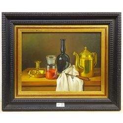 Andras Gombar (Hungarian 1946-): Still Life of Wine Bottle and Brassware, oil on panel signed 29cm x 39cm  