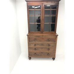  19th century mahogany secretaire bookcase, projecting cornice above two glazed doors enclosing three shelves, single fall front drawer enclosing fitted interior above three drawers, turned supports, W111cm, H197cm, D50cm  