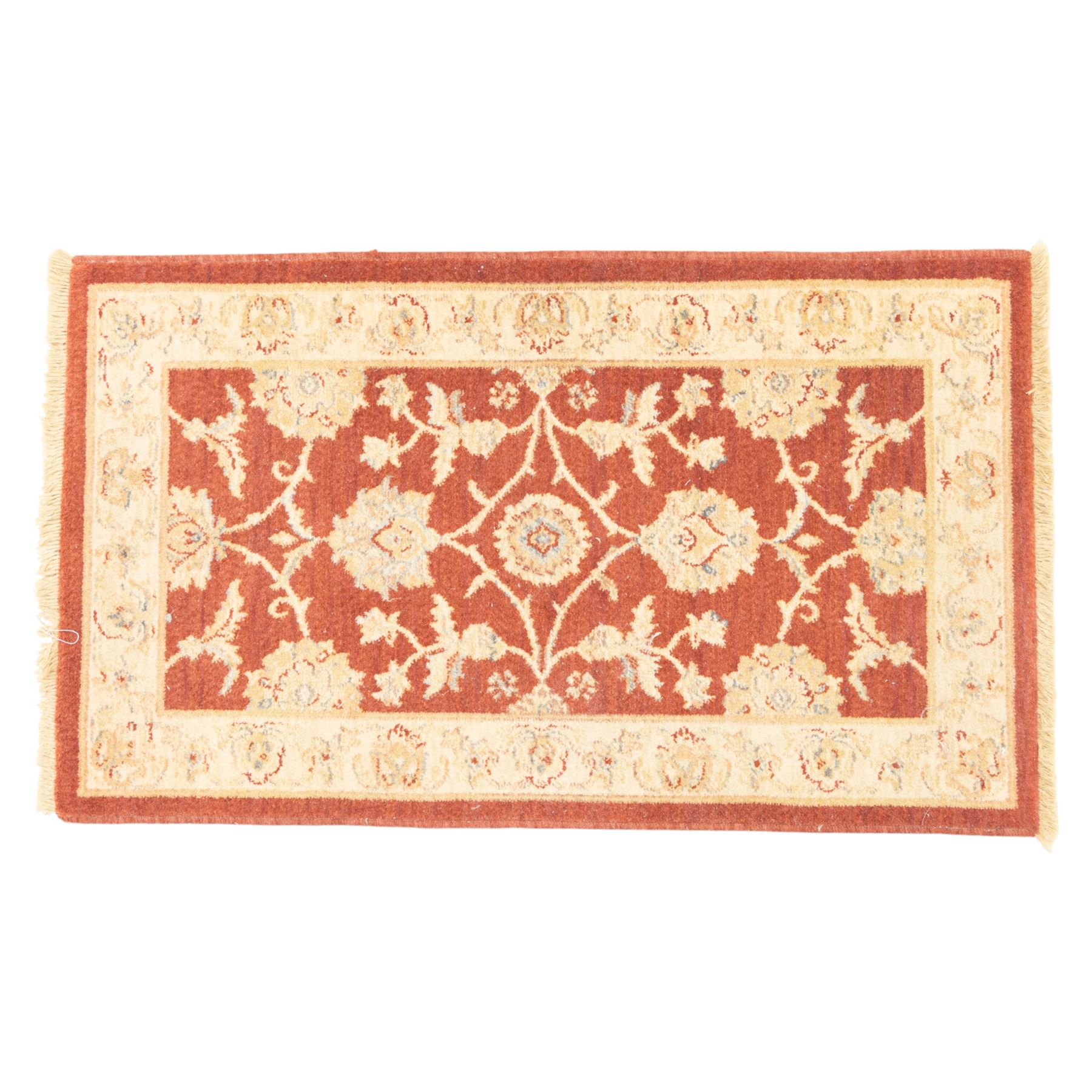 Lot of three Indo-Ziegler style wool rugs, comprising one with central floral medallion and palmette border, and two matching examples with scrolling vine and flowerhead motifs on a deep red field, each with decorative border in soft gold tones (60cm x 85cm) (65cm x 115cm)