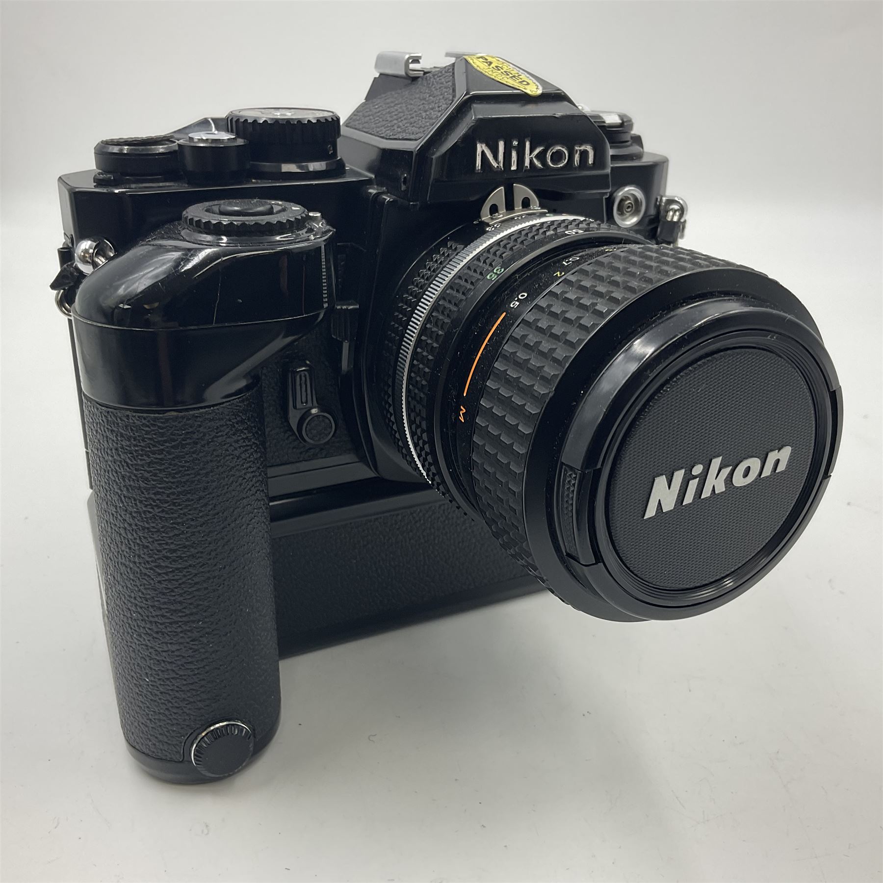 Nikon FM2n camera body, serial no. N8683100, with 'Nikon Zoom-NIKKOR 35-70mm 1:3.3-4.5' len, serial no. 2236565, Nikon MF-16 data back, serial no. 212905 and Nikon MD-12 Motor Drive, serial no 1570382 