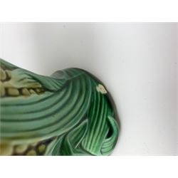 A Victorian majolica bread plate depicting corn within a woven basket, L33cm, together with a Victorian majolica jug modelled in the form of a corn cob, with registration mark beneath, H22cm. 