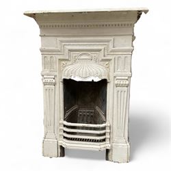 Two Victorian small cast iron fireplaces in a white finish