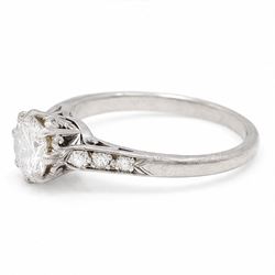 Platinum diamond ring, single round brilliant cut diamond of approx 0.85 carat, with diamond set shoulders, stamped Plat