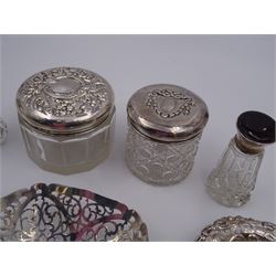 Group of silver, comprising bon bon dish with pierced sides, hallmarked Deakin & Francis Ltd, Birmingham 1973, two pin dishes, two glass bottles with silver lids and two glass jars with silver lids, all hallmarked