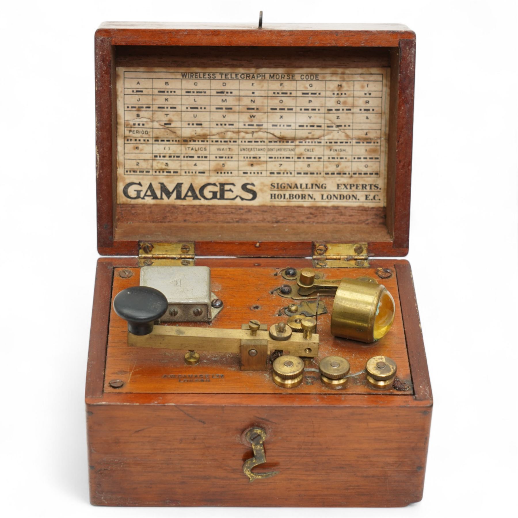 World War II Type B-6 leather flying helmet, property Air Force U.S. Army and a Gamages morse code signaller in mahogany box (2)