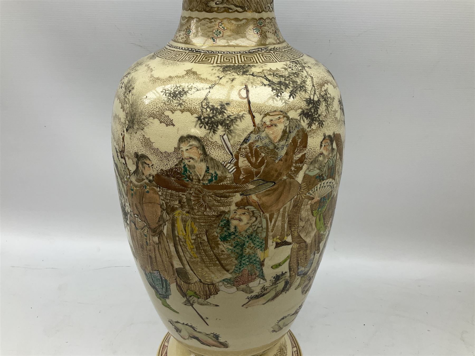 Pair early 20th Century Japanese floor vases of ovoid form, painted with warriors and elders within geometric designs and gilding, H61cm