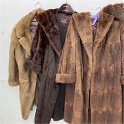 Four ladies three quarter length fur coats, by Dysons Furriers Ltd, Commercial St, Leeds, comprising of a light brown mink fur coat, two dark brown mink fur coats and another brown fur coat.  