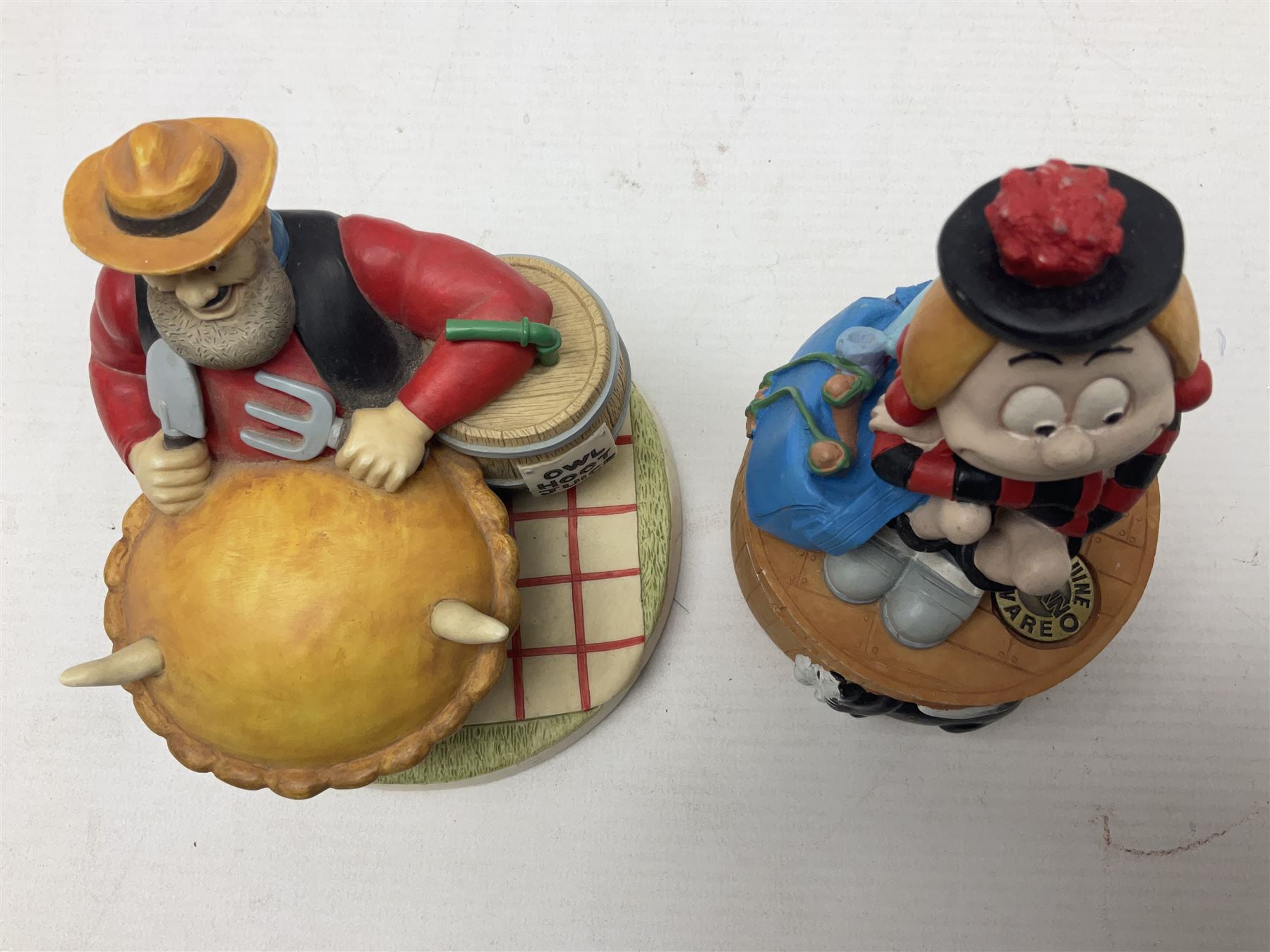 Eleven Robert Harrop figures from the Beano Dandy collection, comprising One Man & His Dawg BDS08, Picnic Desperate Dan BDS04, Fatty BD07, Desperate Dan BD03, Roger the Dodger BD20, Dennis the Menace BD01, Beryl the Peril BD05, Minnie the Minx BD04, Surfing BP03, two Spotty BD16, together with a Genuine Beano Ware lidded box (12)